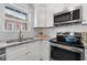 Updated kitchen with white cabinets and granite countertops at 1230 Piedmont Ne Ave # 405, Atlanta, GA 30309