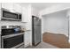 Modern kitchen featuring stainless steel appliances and white cabinets at 1230 Piedmont Ne Ave # 405, Atlanta, GA 30309