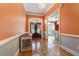 Bright entryway with hardwood floors and view to dining room at 5542 Capstone Way, Douglasville, GA 30135