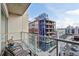Balcony with city views and seating for two at 1100 Howell Mill Nw Rd # 610, Atlanta, GA 30318