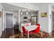 Modern dining area with red chairs and a patterned rug at 1100 Howell Mill Nw Rd # 610, Atlanta, GA 30318