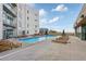 Relaxing pool area with lounge chairs and building views at 1100 Howell Mill Nw Rd # 610, Atlanta, GA 30318