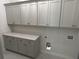 Functional laundry room with plenty of cabinets and countertop space at 1109 Cooks Farm Way, Woodstock, GA 30189