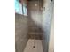 Beautiful walk-in shower with tiled walls and a rainfall showerhead at 1109 Cooks Farm Way, Woodstock, GA 30189