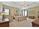 Large main bedroom with carpeted floor and ceiling fan at 1409 Woodmere Ct, Mcdonough, GA 30252