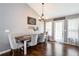 Dining room with hardwood floors, farmhouse table, and gray walls at 2064 Queensbury Dr, Acworth, GA 30102