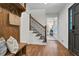 Entryway with wood bench, coat rack, and staircase with metal railing at 2100 Wood Ct, Marietta, GA 30062