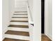 Modern staircase with dark wood treads and white risers at 2301 N Decatur Rd, Decatur, GA 30033