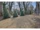 Landscaped backyard with mature trees and privacy at 3179 Clairebrooke Ave, Atlanta, GA 30341