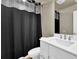 Main bathroom with shower/tub combo and white vanity at 3179 Clairebrooke Ave, Atlanta, GA 30341