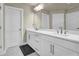 Modern bathroom with double vanity and quartz countertops at 3179 Clairebrooke Ave, Atlanta, GA 30341