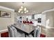 Bright dining room features a large table and modern chandelier at 3179 Clairebrooke Ave, Atlanta, GA 30341