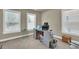 Home office with built-in desk and large windows at 3179 Clairebrooke Ave, Atlanta, GA 30341