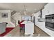 Modern kitchen with white cabinets, quartz countertops, and stainless steel appliances at 3179 Clairebrooke Ave, Atlanta, GA 30341