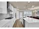 Modern kitchen with white cabinets, quartz countertops, and stainless steel appliances at 3179 Clairebrooke Ave, Atlanta, GA 30341