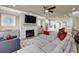 Spacious living room with sectional sofa, fireplace, and large TV at 3179 Clairebrooke Ave, Atlanta, GA 30341