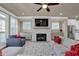 Living room with sectional sofa, fireplace, and large TV at 3179 Clairebrooke Ave, Atlanta, GA 30341