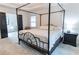 Main bedroom with a large bed, carpet, and ensuite bathroom at 4222 Honey Creek Way, Powder Springs, GA 30127