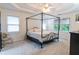 Spacious bedroom with carpet, ceiling fan, and large windows at 4222 Honey Creek Way, Powder Springs, GA 30127