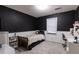Cozy bedroom with a twin bed and dark-painted accent wall at 4222 Honey Creek Way, Powder Springs, GA 30127