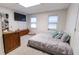 Spacious bedroom with large bed, TV, and ample natural light at 4222 Honey Creek Way, Powder Springs, GA 30127
