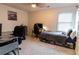 Bedroom with a full-size bed, workspace, and gaming chair at 4222 Honey Creek Way, Powder Springs, GA 30127