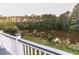 Deck overlooks peaceful lake and tree-lined landscape at 4222 Honey Creek Way, Powder Springs, GA 30127