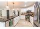 Updated kitchen with white cabinets, granite countertops, and stainless steel appliances at 4222 Honey Creek Way, Powder Springs, GA 30127