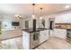 Modern kitchen with island, stainless steel appliances, and open layout at 4222 Honey Creek Way, Powder Springs, GA 30127