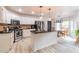 Modern kitchen with white cabinets, island, and stainless steel appliances at 4222 Honey Creek Way, Powder Springs, GA 30127