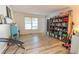 Spacious living room with hardwood floors and built-in shelving at 4222 Honey Creek Way, Powder Springs, GA 30127