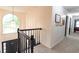 Upstairs hallway with carpeting and access to bedrooms at 4222 Honey Creek Way, Powder Springs, GA 30127