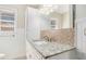 Bathroom boasts granite countertop and tile backsplash at 6747 Rockland Rd, Lithonia, GA 30038