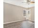 Bedroom with wood-look floors, ceiling fan, and access to bathroom at 6747 Rockland Rd, Lithonia, GA 30038