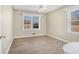 Bright bedroom with wood-look floors and large window at 6747 Rockland Rd, Lithonia, GA 30038