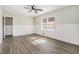 Bright bedroom with wood-look floors and neutral walls at 6747 Rockland Rd, Lithonia, GA 30038