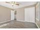 Bedroom with wood-look floors, closet, and ceiling fan at 6747 Rockland Rd, Lithonia, GA 30038