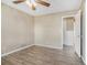 Spacious bedroom with wood-look floors and access to hallway at 6747 Rockland Rd, Lithonia, GA 30038