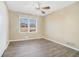 Well-lit bedroom featuring wood-look floors and ceiling fan at 6747 Rockland Rd, Lithonia, GA 30038