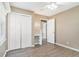 Bright bedroom featuring wood-look floors and ceiling fan at 6747 Rockland Rd, Lithonia, GA 30038