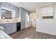 Updated kitchen with gray cabinets and white appliances at 6747 Rockland Rd, Lithonia, GA 30038