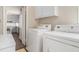 Laundry room with washer, dryer, and extra shelving at 6747 Rockland Rd, Lithonia, GA 30038