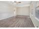 Bright and airy living room with hardwood floors at 6747 Rockland Rd, Lithonia, GA 30038