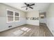 Open living room with wood-look floors and kitchen pass-through at 6747 Rockland Rd, Lithonia, GA 30038