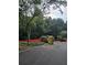 Construction site with portable toilet and heavy equipment surrounded by orange safety fencing and trees at 3910 W Cooper Lake Se Dr, Smyrna, GA 30082