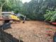 Excavation site showcasing heavy machinery and safety fencing; land being prepped for new construction at 3910 W Cooper Lake Se Dr, Smyrna, GA 30082