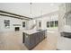 Open concept kitchen with island, hardwood floors, and exposed beams at 3910 W Cooper Lake Se Dr, Smyrna, GA 30082