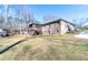 Expansive backyard with mature trees and a charming screened-in porch at 4801 Daniel Mill Rd, Winston, GA 30187