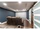 Finished basement features theater seating and sliding barn doors for an additional room at 4801 Daniel Mill Rd, Winston, GA 30187