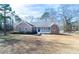 Attractive single-story home showcasing a brick exterior, covered entryway, and expansive front lawn at 4801 Daniel Mill Rd, Winston, GA 30187